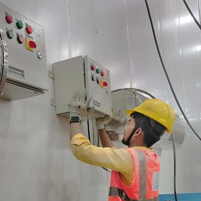 Industrial engineer working on control panel